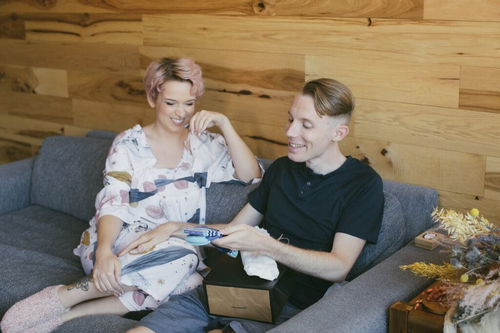 A bride gives her future husband a silly gift on their wedding morning. 