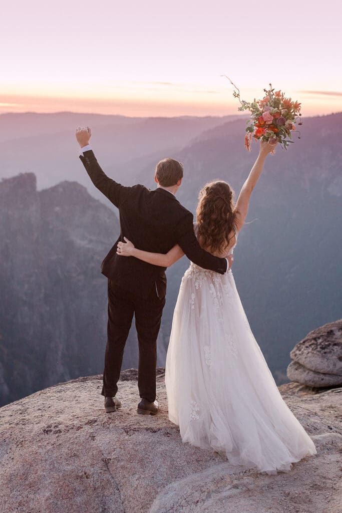 A bride and groom cheer to their wedding on their Yosemite Elopement