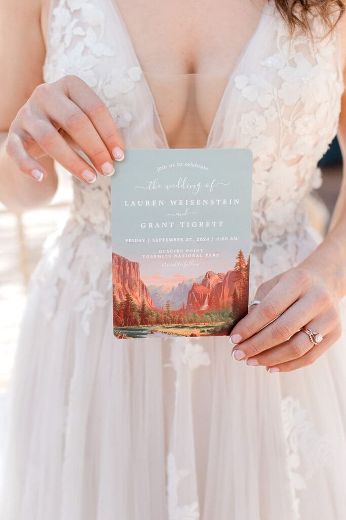 A bride holds her wedding invitation.
