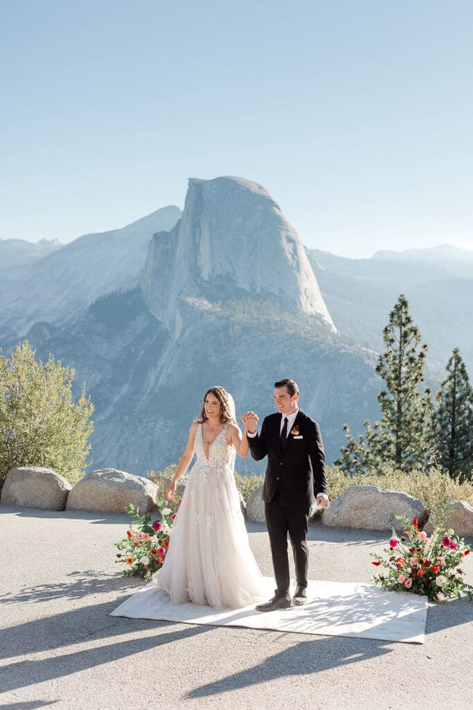 A bride and groom immediately at the end of their wedding ceremony at Yosemite National Park.