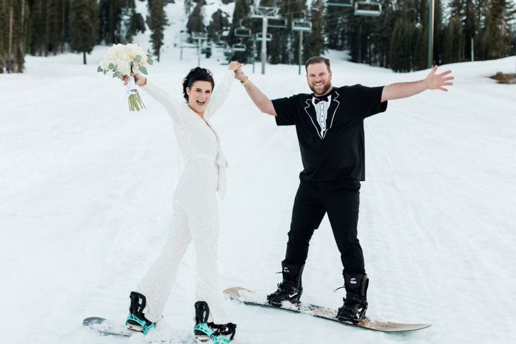 A bride and groom snowboard on their wedding day in June Lakes