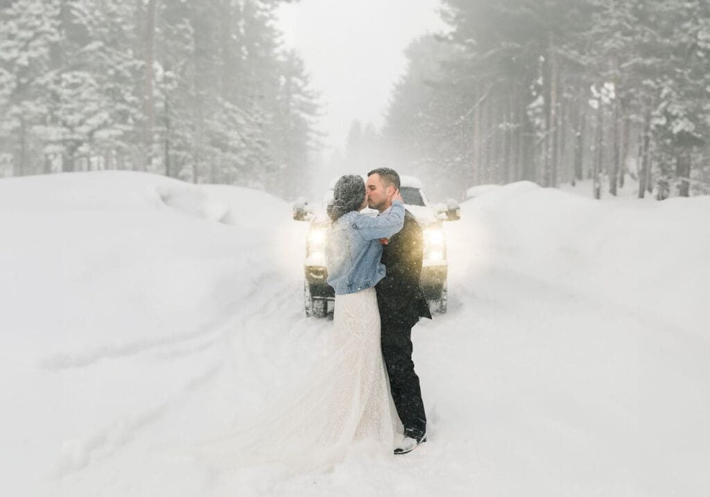 A bride and groom kiss on their snow mammoth lakes wedding day.