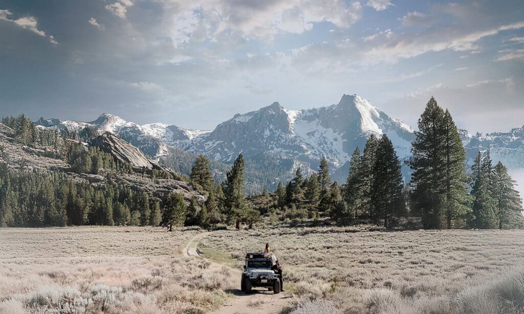 A bride and groom explore a forest service road with their jeep on their wedding day in Mammoth Lakes.