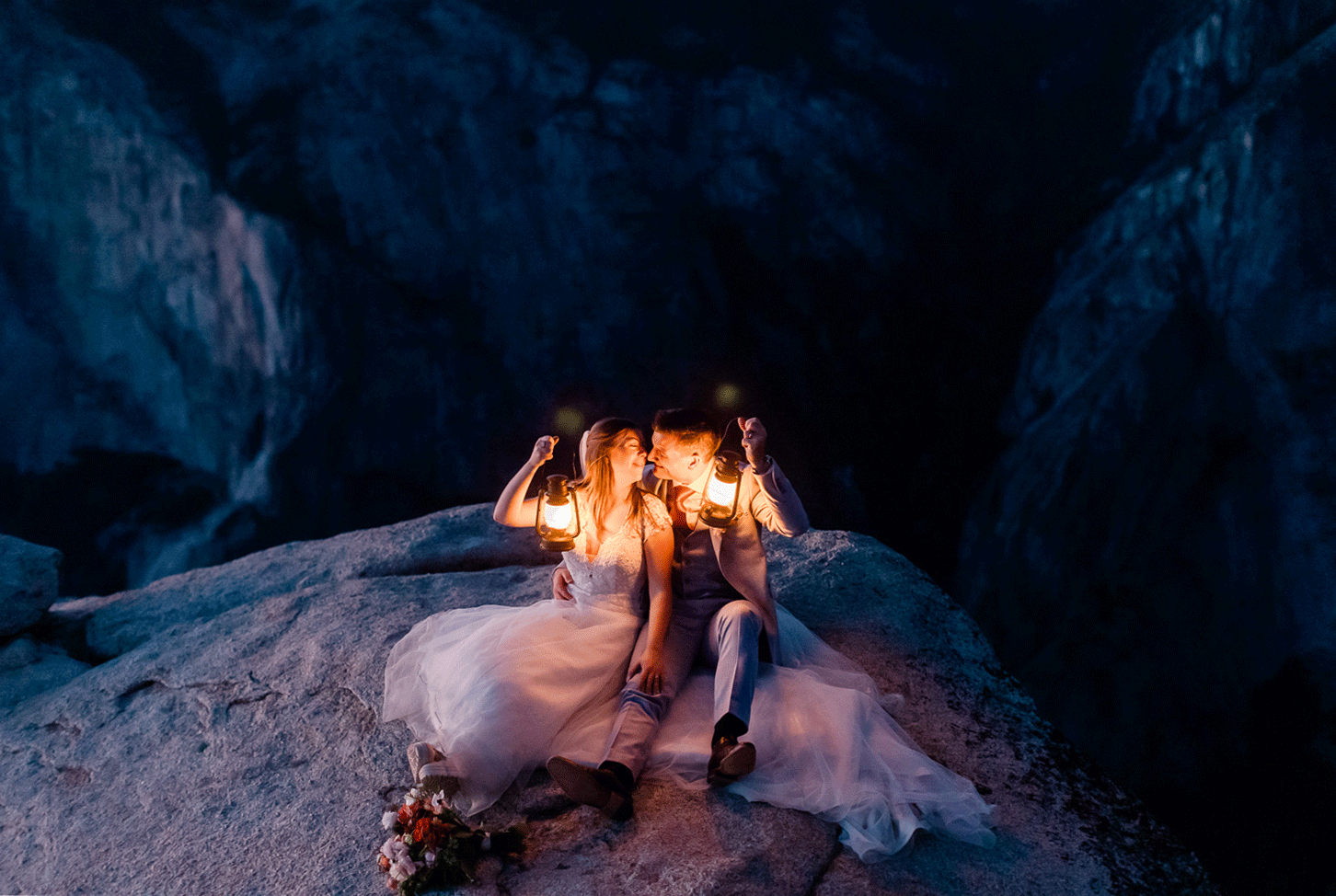 A bride and groom kiss in the dark at Taft point on their wedding day.