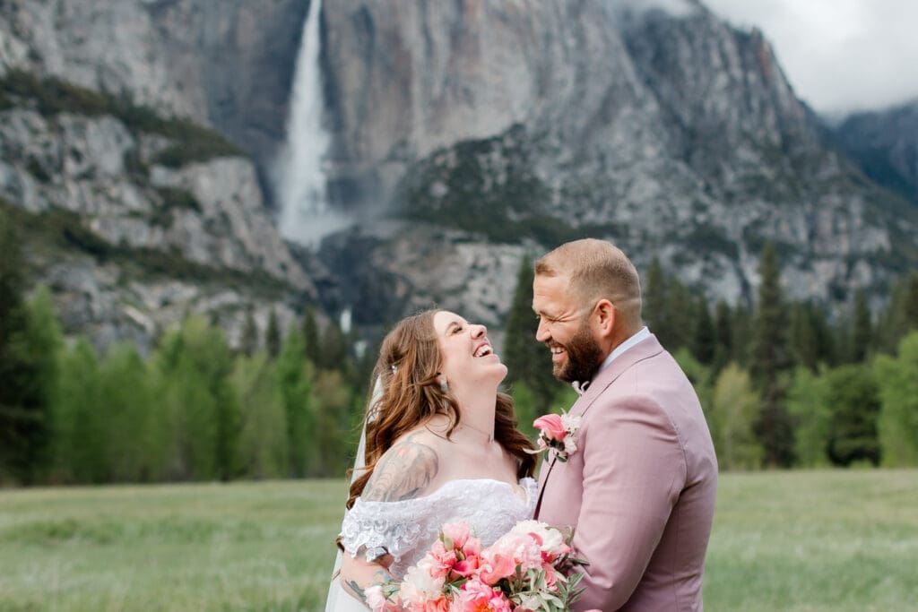 a bride and groom in a yosemite meadow